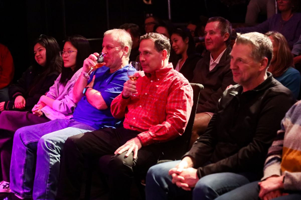 Front-row guests grinning during a Rick Silver show at Studio 13