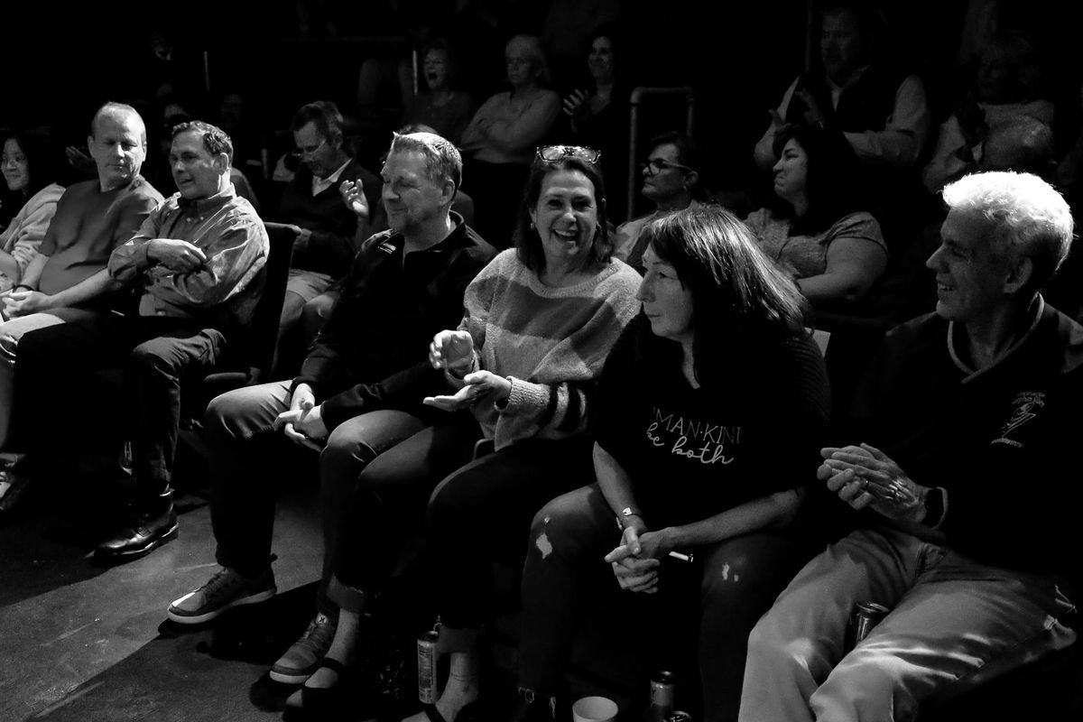 Audience members laughing and clapping during a Rick Silver show at Studio 13
