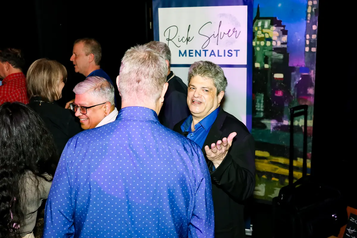 Rick Silver performing mentalism for a small group during a corporate cocktail hour